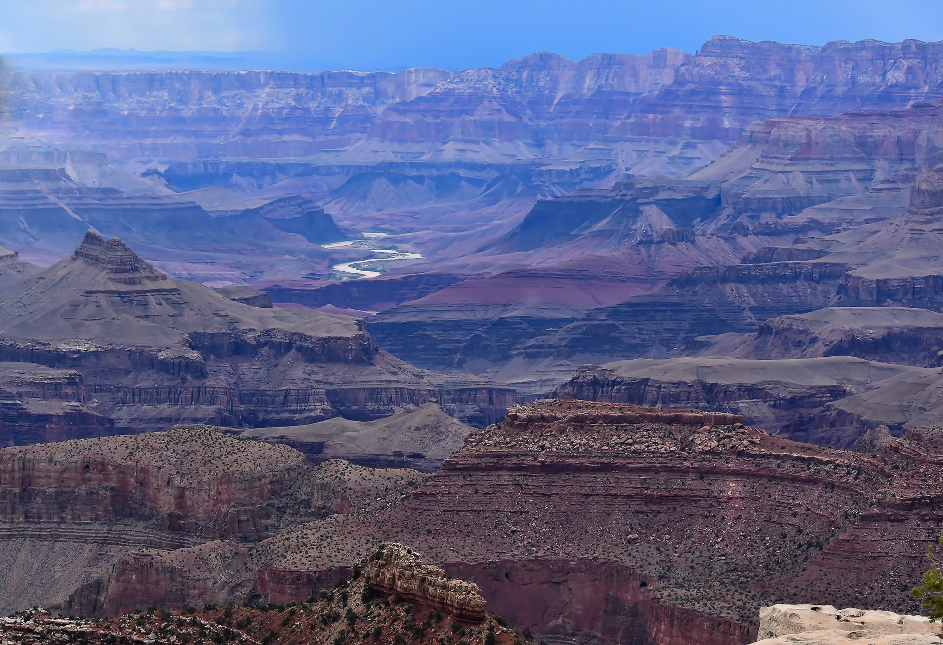 Stunning view of Grand Canyon landscape and Colorado River from a high vantage point.
