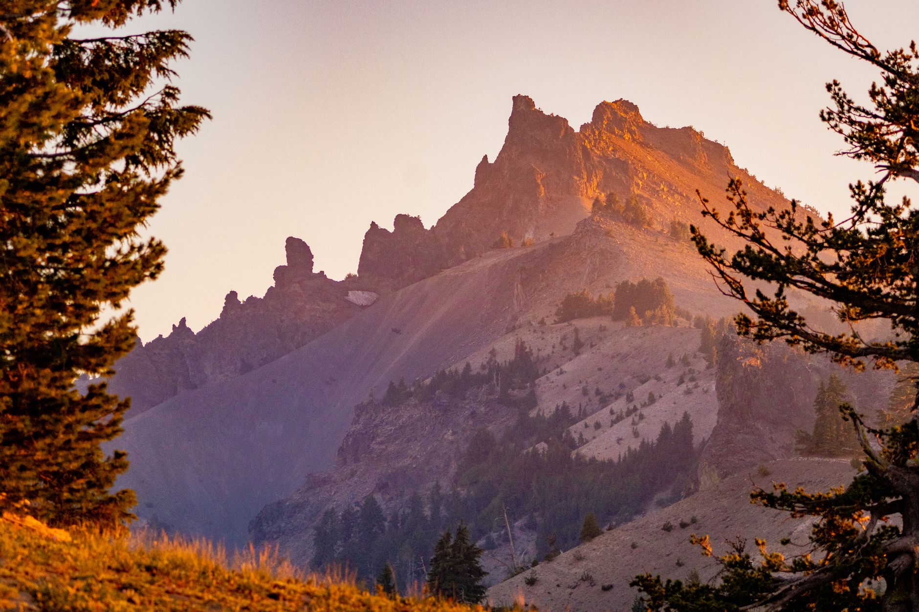 Breathtaking view of rugged pinnacles during sunset in Crater Lake National Park, Oregon.