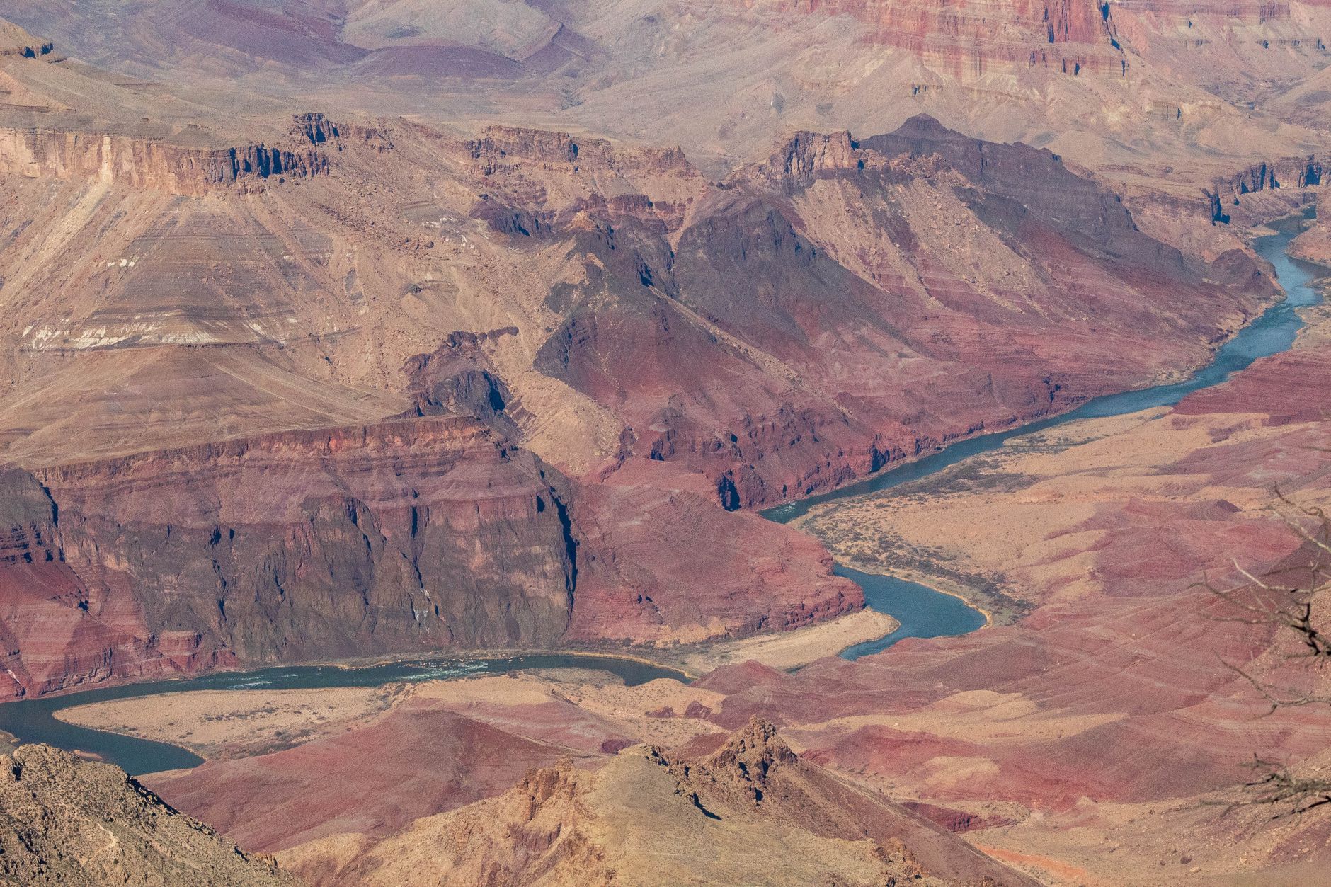 A breathtaking aerial shot of the Grand Canyon showcasing its vibrant geological features.