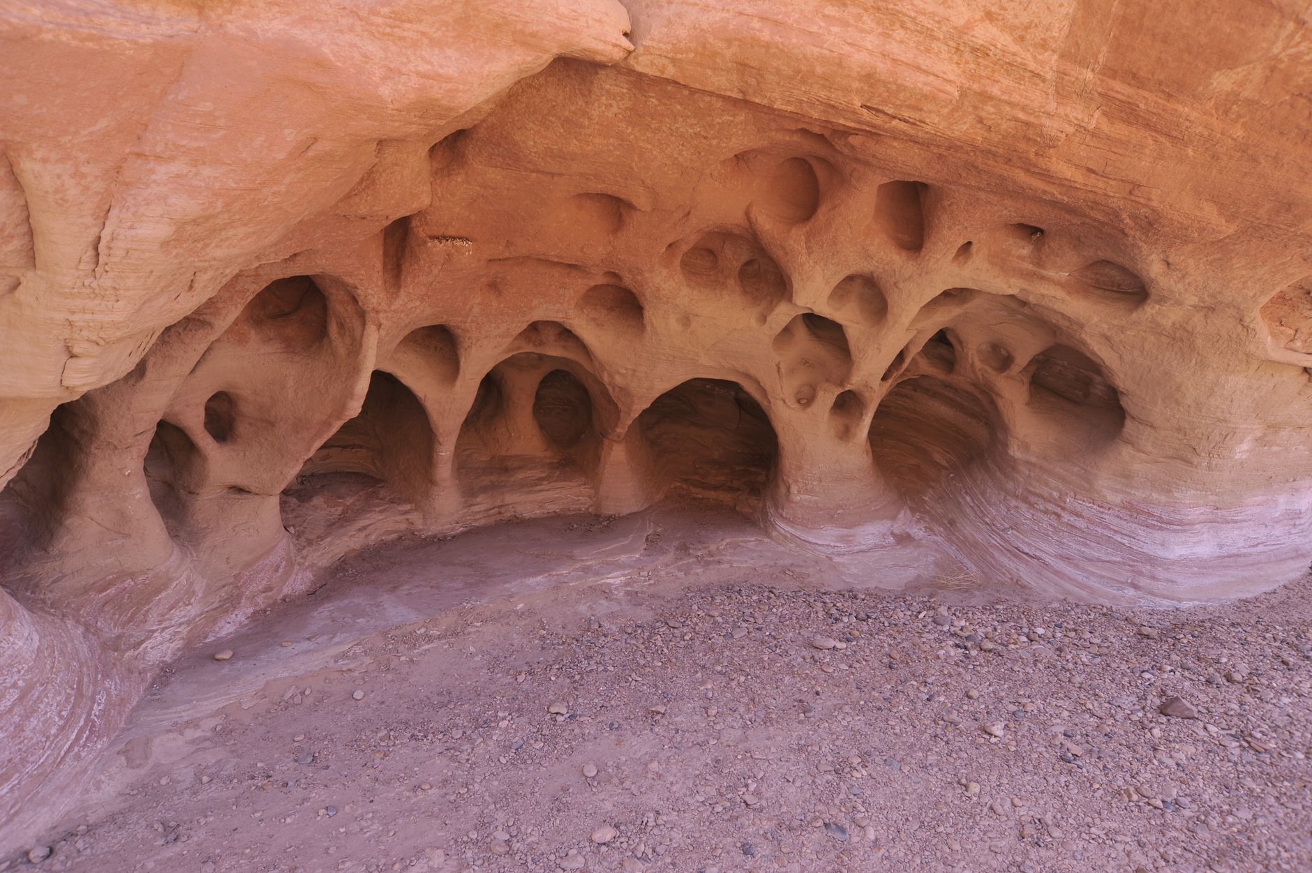 A close-up view of intricate sandstone cavern formations showcasing erosion effects and geological features.