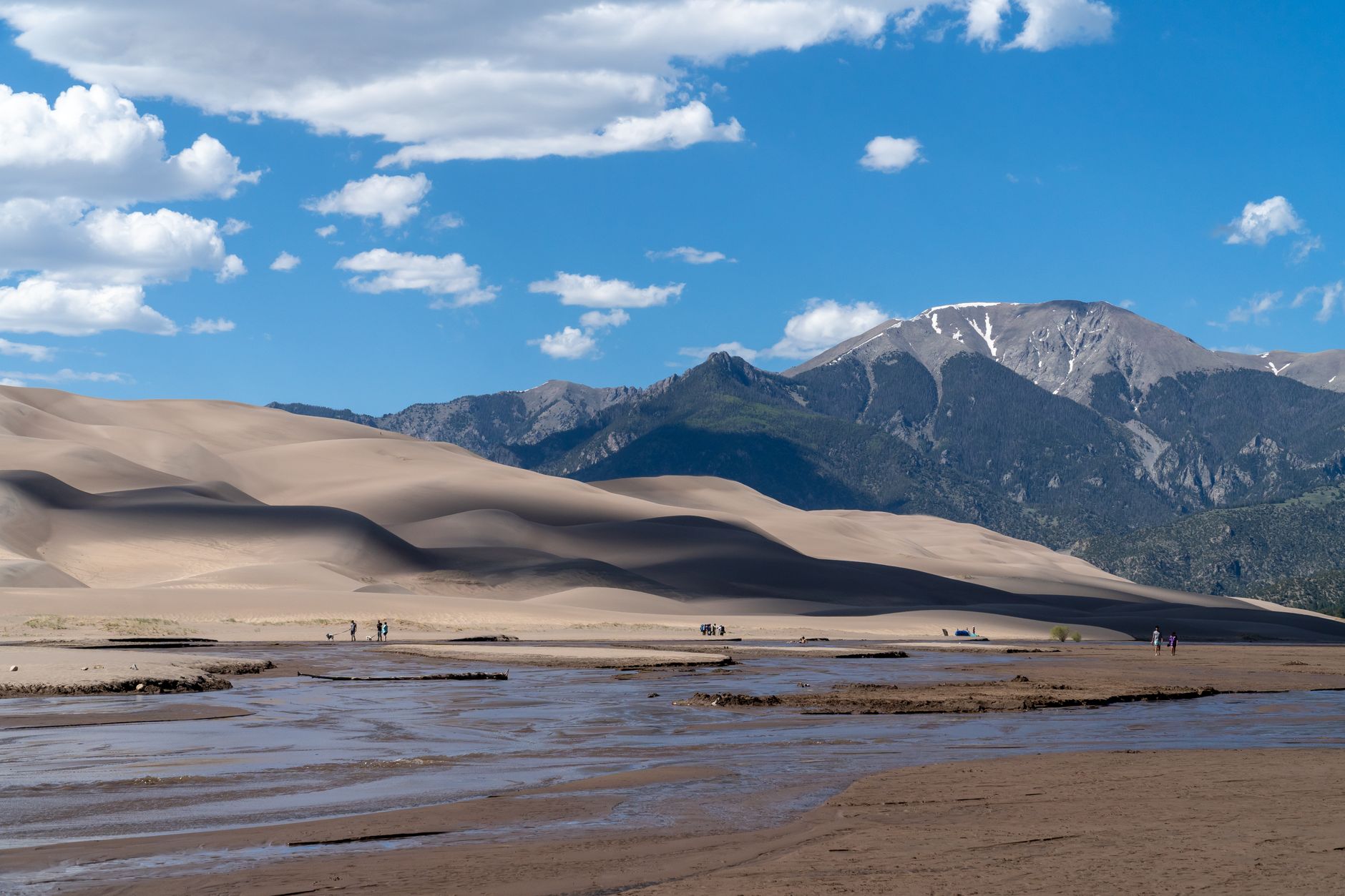 Capture of Colorado's Great Sand Dunes with the Sangre de Cristo Mountains in the background, showcasing natural beauty.
