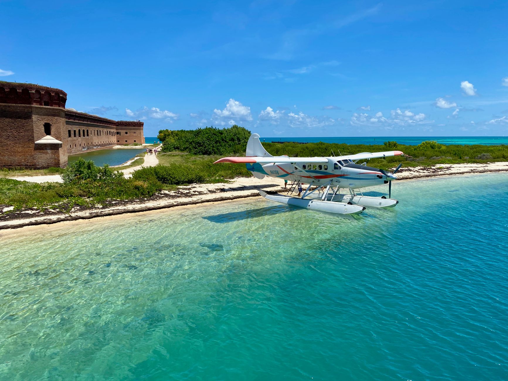 Scenic view of a seaplane docked by Fort Jefferson in Dry Tortugas National Park, Florida.