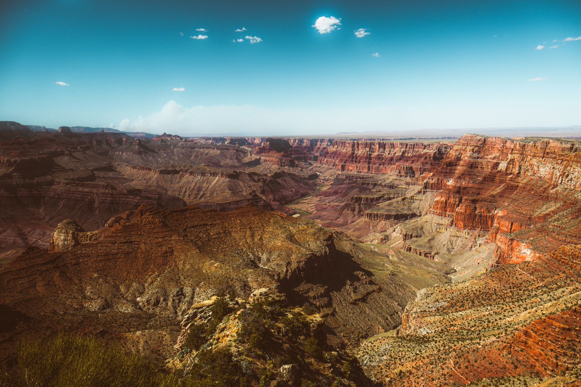 Explore the breathtaking landscape of the Grand Canyon with its vibrant and dramatic rock formations.