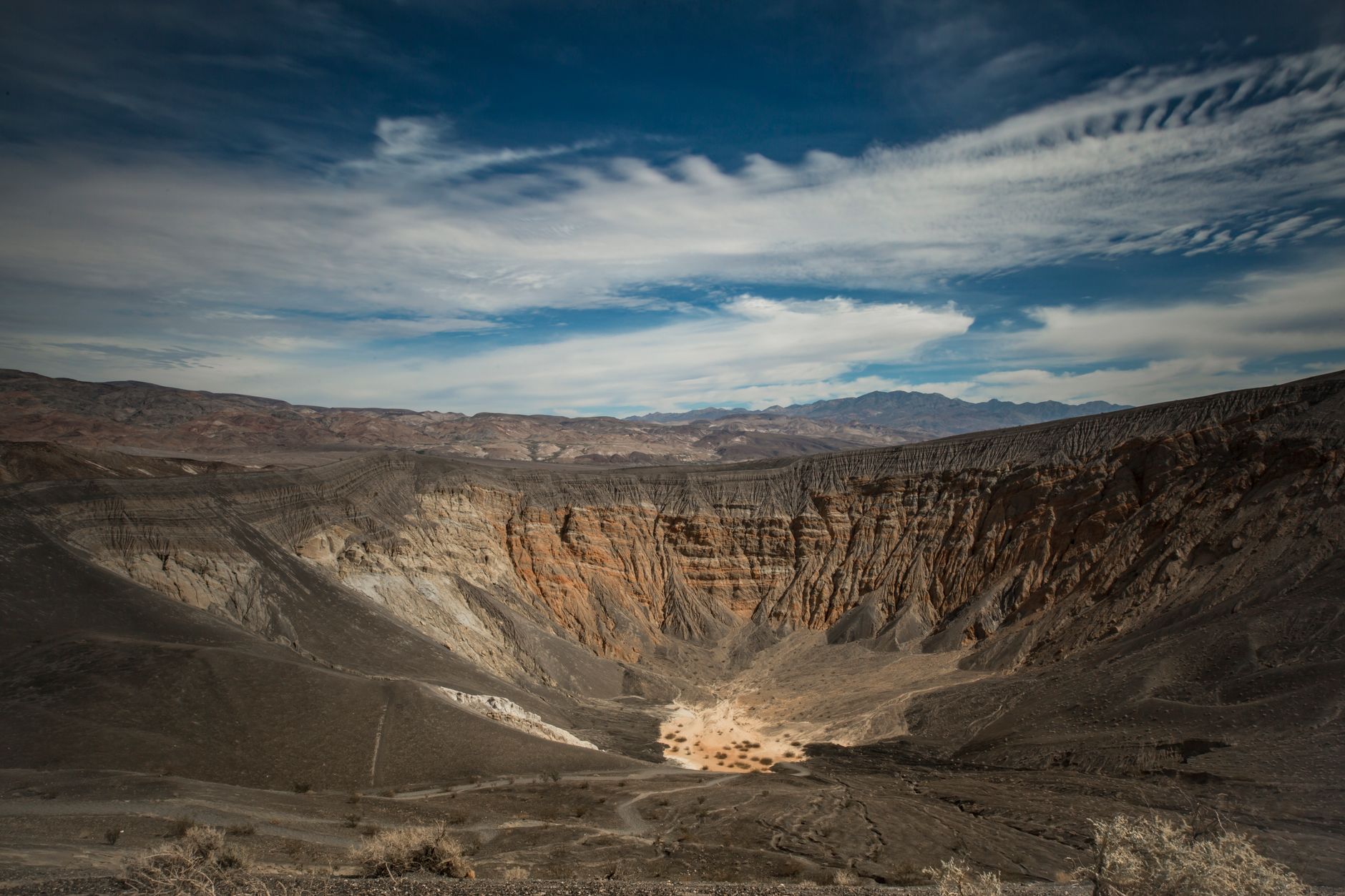 Stunning landscape of Ubehebe Crater in Death Valley under a vivid sky.
