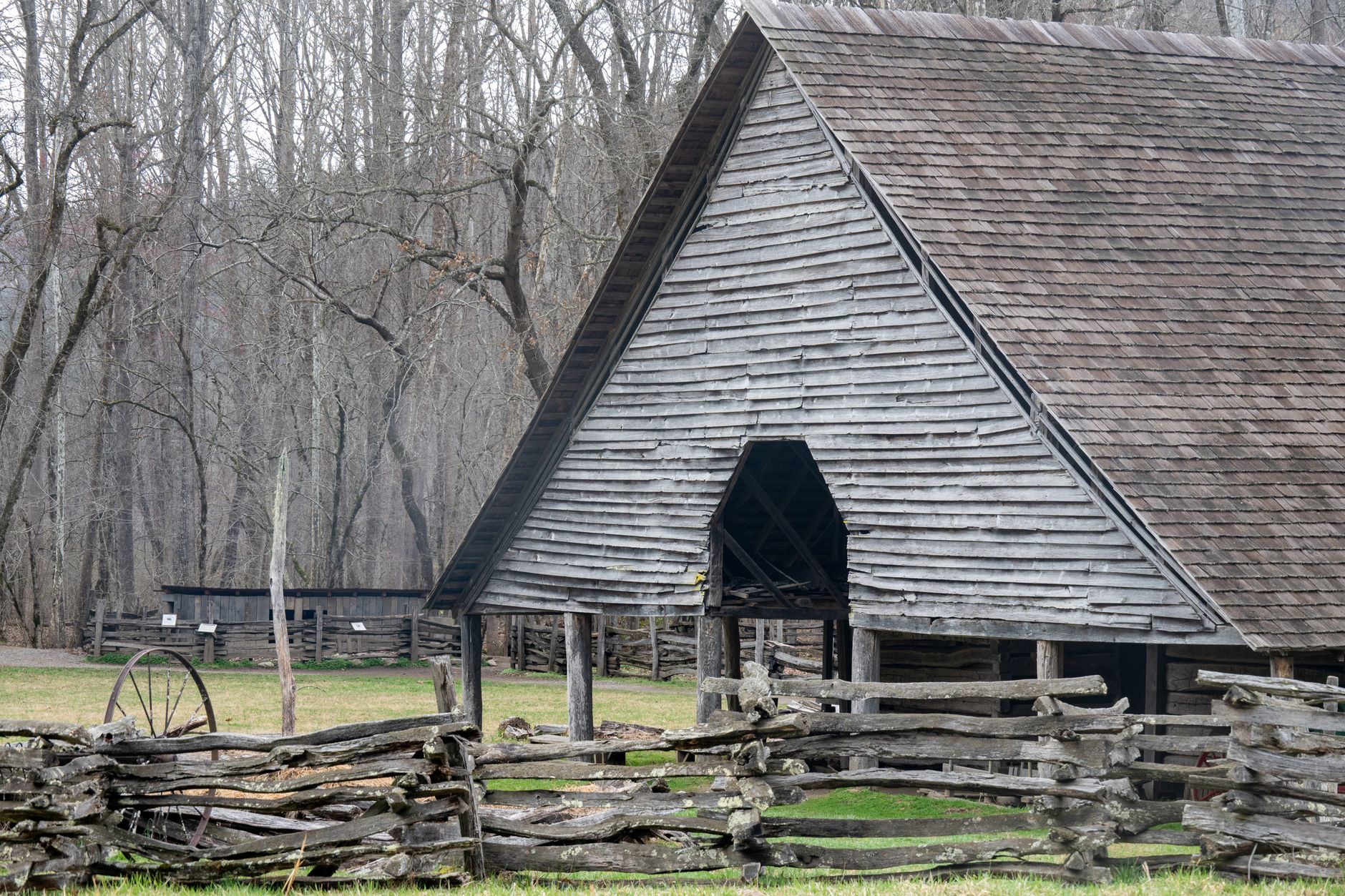 Historic wooden barn with split-rail fence in Great Smoky Mountains National Park.
