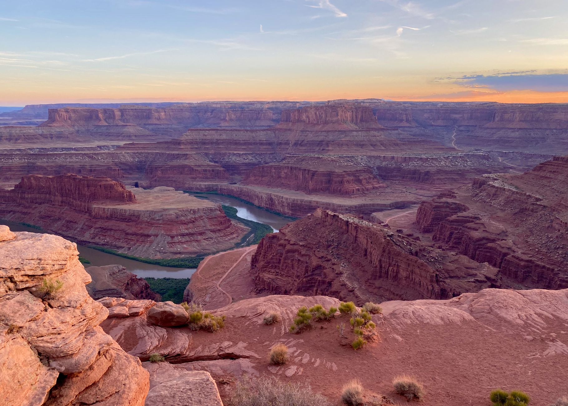 Breathtaking view of Canyonlands National Park showcasing red rock formations at sunset.